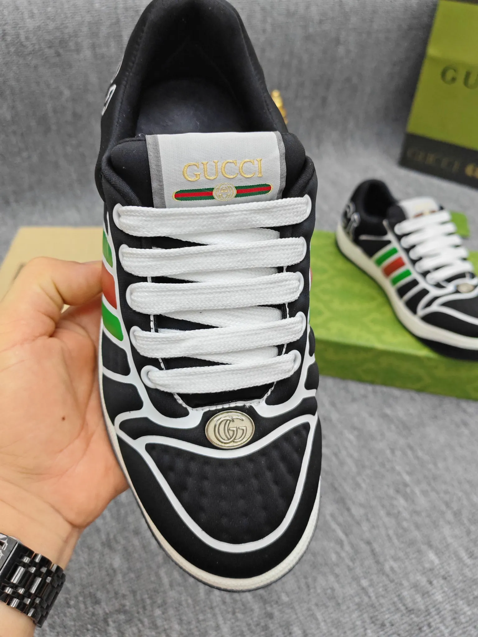 Factory price 600💰Screener series embellished web sneakers. This item is from the Gucci Lido series. Its design is inspired by the summer style and beach clubs of the Italian coast. The Screener series of sneakers draws inspiration from classic sneakers from the 1970s and takes its name from a special defensive move in sports. This shoe from the 2024 Pre-Fall collection is crafted from yellow rubber, a technical and malleable opaque material, with striped webbing on the sides and an embossed Gucci printed logo on the heel. Yellow rubber, opaque and technological in appearance. Red and green webbing decorated with metal Double G oval enamel details. Gucci printed embossed logo. Women 35-40, men 38-45, (men 38 and 45 need to be customized)